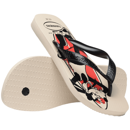 Flip flops with mickey mouse and goofy in red, beige, and black with surf boards with a wave behind them, with black straps, one sandal leaning on the other toe side down