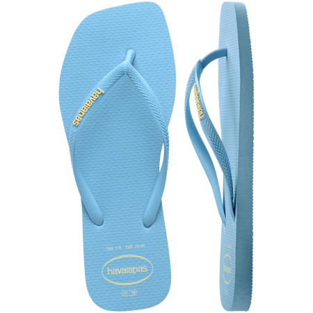 light blue womens flip flops with square toe and light blue straps with the yellow havaianas logo, one sandal top view, one sandal side view