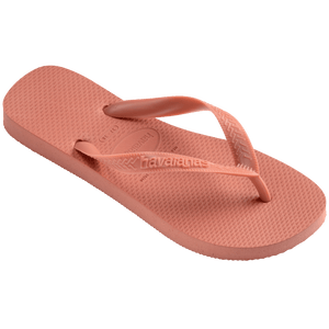 peach flip flops with rice pattern detail on sole and peach straps, front side view