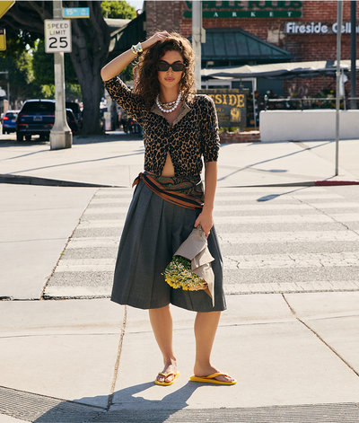 woman with yellow havaianas top flip flops standing on a road