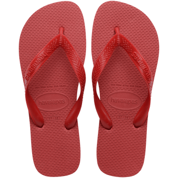 Pair of red Havaianas flip flops on a transparent background