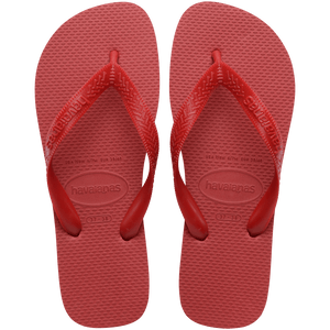 Pair of red Havaianas flip flops on a transparent background