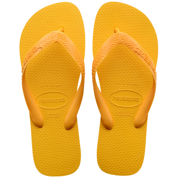 yellow Havaianas flip flops with a thicker top strap on a transparent background