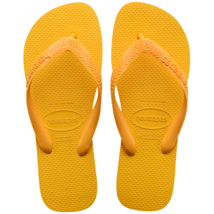 yellow Havaianas flip flops with a thicker top strap on a transparent background