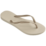 Women's beige flip flops with gold straps, right 3/4 side view