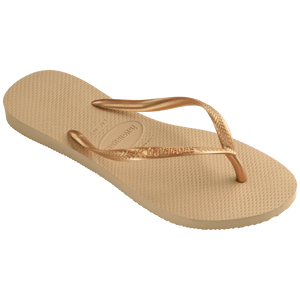 Women's tan flip flops with gold metallic straps 3/4 side view
