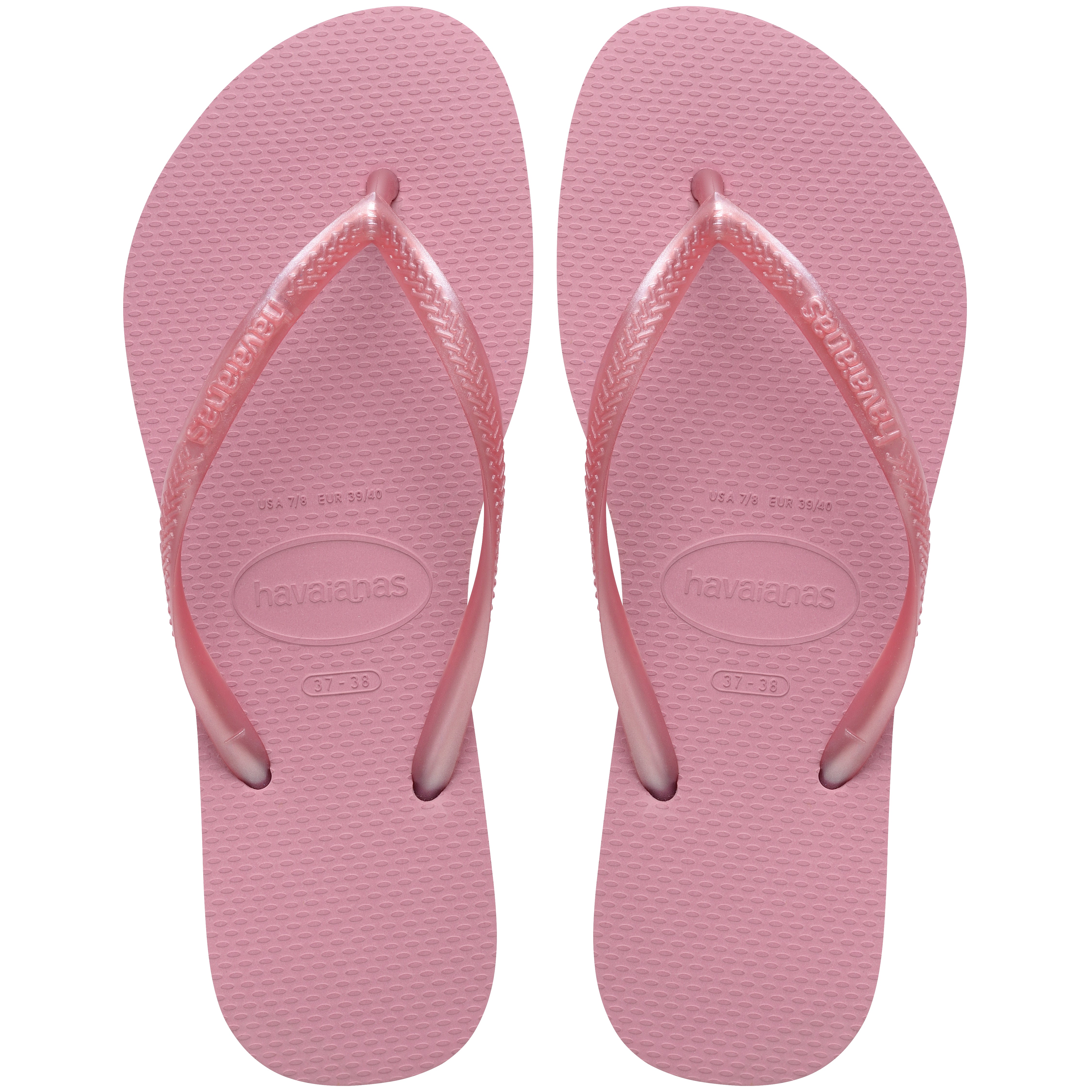 Pair of pink flip flops with Havaianas branding on a white background