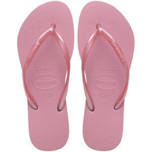 Pair of pink flip flops with Havaianas branding on a white background