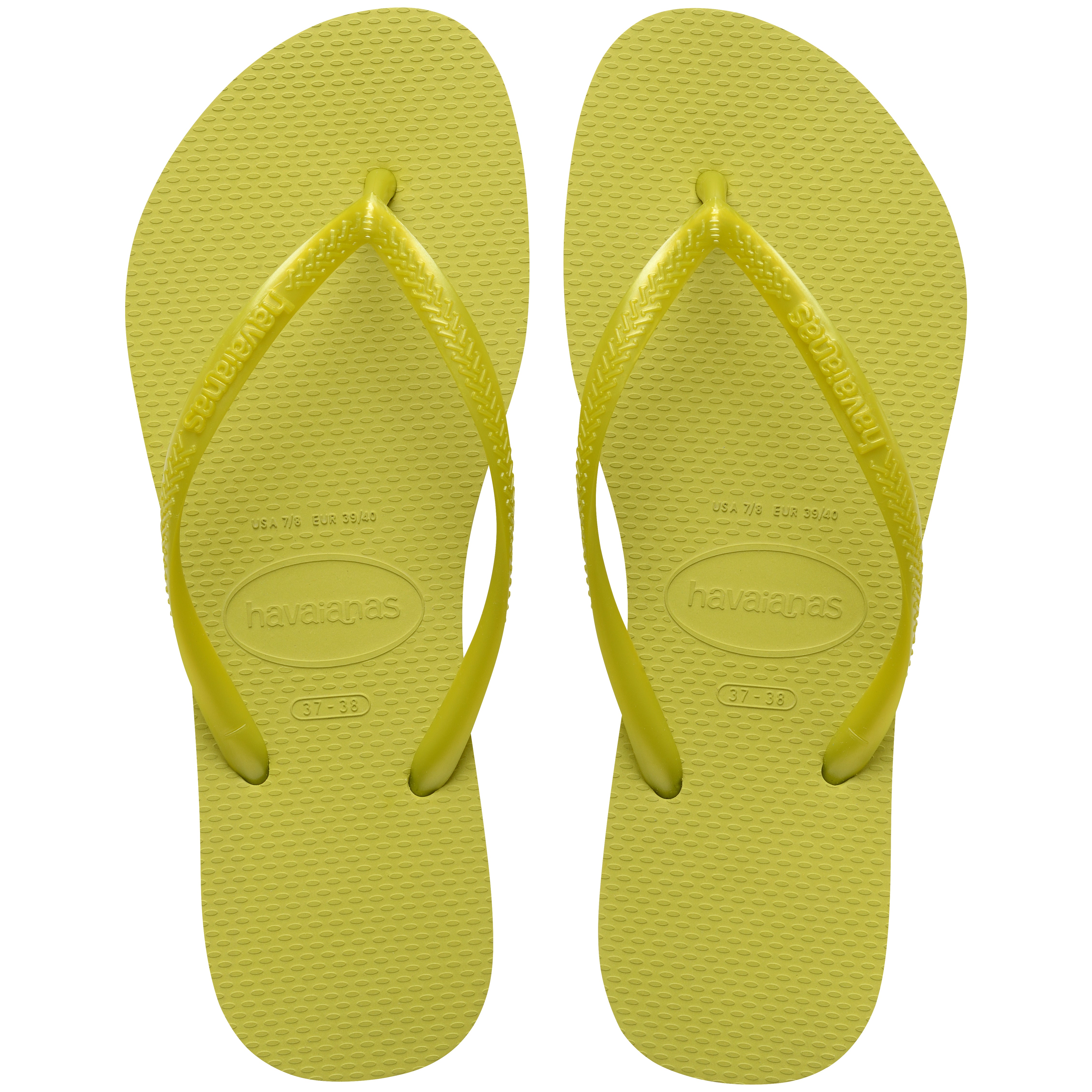 Pair of lime green flip flops with Havaianas branding on a white background