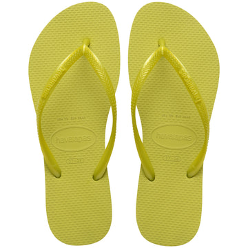 Pair of lime green flip flops with Havaianas branding on a white background