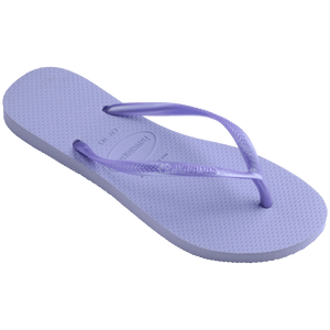 Women's light purple flip flops with metallic purple straps, 3/4 side view