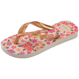 Single, left, floral patterned Havaianas flip flop with gold straps on a white background