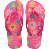 Pair of pink Havaianas flip flops with floral design on a white background