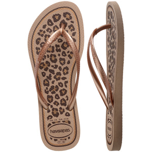 Pair of leopard print flip flops with Havaianas logo on a white background, with left shoe in focus