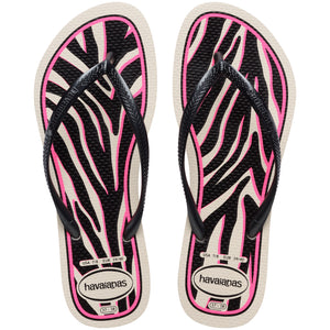 Pair of Havaianas flip flops with pink and black zebra pattern on a white background