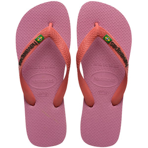 Pair of pink Havaianas flip flops with the thicker top strap on a white background