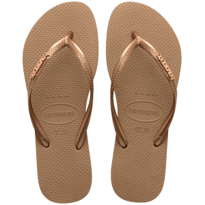 Pair of brown flip flops with Havaianas branding on a transparent background