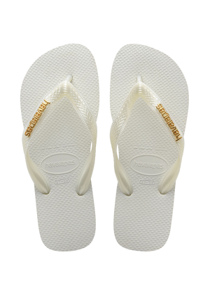 womens white top flip flops with a gold metallic havaianas logo on the strap top view