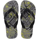 Pair of gray Havaianas flip flops with video game pattern, on a transparent background