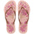 Pair of pink floral flip flops with brown straps and Havaianas logo on a white background