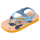 baby sandals with mickey mouse and donald duck on a yellow background with blue straps and a mickey mouse charm, front/diagonal view