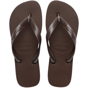 Pair of brown Havaianas flip flops on a white background
