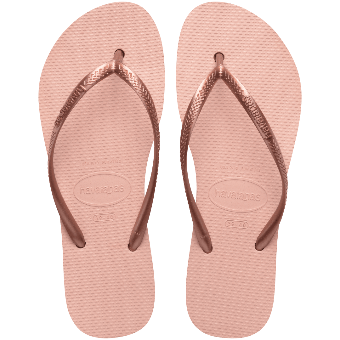 Pair of pink flip flops with a metallic strap on a transparent background