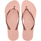 Pair of pink flip flops with a metallic strap on a transparent background