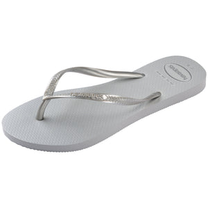 single, left side Havaianas grey flip flop with a textured, glitter sole on a white background 