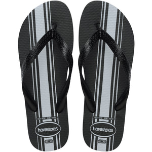 Pair of Havaianas flip flops with black and gray striped design on a white background