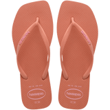 square-toe flip flop in orange color with pink havaianas logo on the strap, top facing