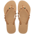 Women's tan flip flops with gold metallic straps featuring multicolor crystals top view