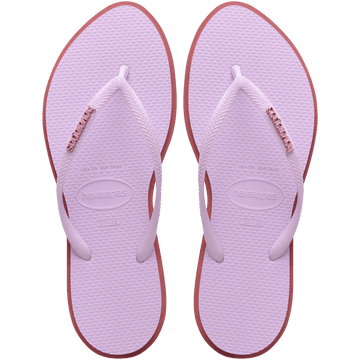 Women's light purple pointed toe flip flops with red contrast sole, top view