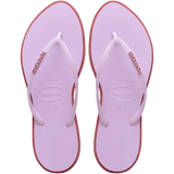 Women's light purple pointed toe flip flops with red contrast sole, top view