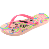 Powerpuff Girls flying on a neon green, blue, and pink background sole of flip flops, with pink straps with black Havaianas logo, front left view