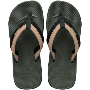 sage/olive green sandals with toe grooves and black and tan straps, top view