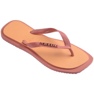 Single, right pink and orange Havaianas flip flop on a white background