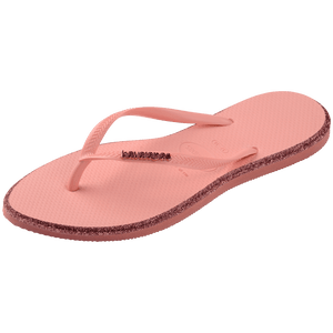 Single, left, pink Havaianas flip flop with glitter accent and gold logo on the strap on a transparent background
