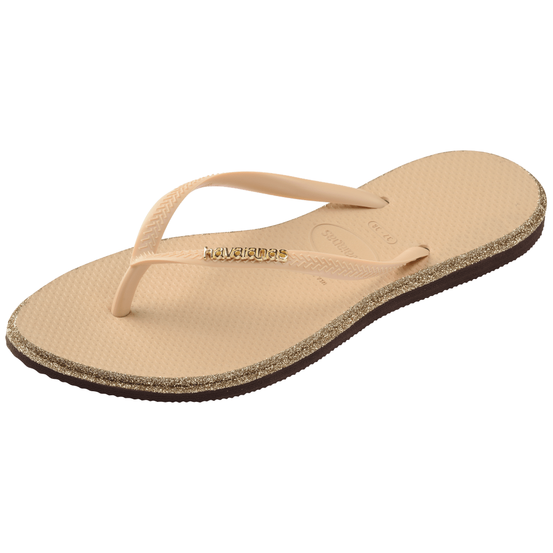 Single, left, beige Havaianas flip flop with glitter accent and gold logo on the strap on a transparent background
