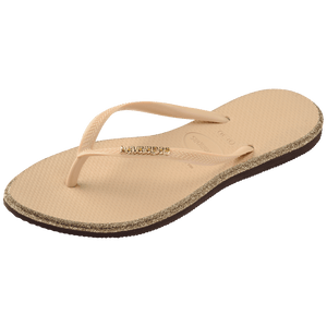 Single, left, beige Havaianas flip flop with glitter accent and gold logo on the strap on a transparent background