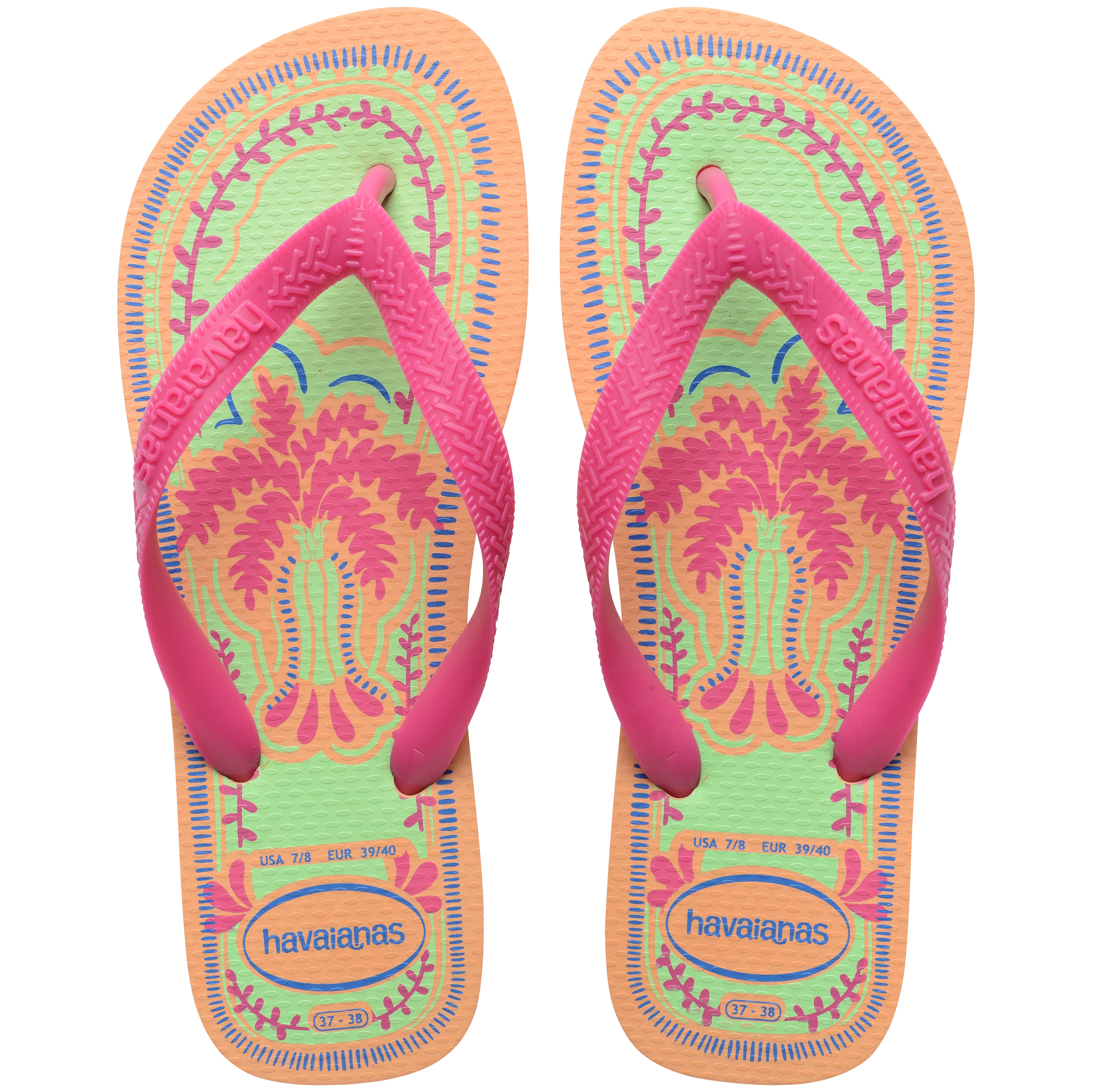 Pair of Havaianas flip flops with pink straps and colorful palm tree design on a white background