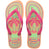 Pair of Havaianas flip flops with pink straps and colorful palm tree design on a white background