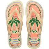 Pair of Havaianas flip flops with a tropical design on a white background