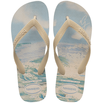 Gigi Hadid x Havaianas blue, green, and beige flip flops with beach pattern on footbed with beige straps, top view