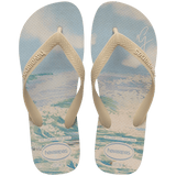 Gigi Hadid x Havaianas blue, green, and beige flip flops with beach pattern on footbed with beige straps, top view