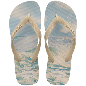 Gigi Hadid x Havaianas blue, green, and beige flip flops with beach pattern on footbed with beige straps, top view