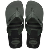 Pair of green, two tone Havaianas flip flops on a white background