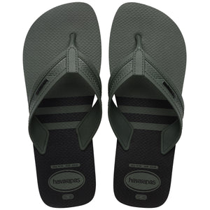 Pair of green, two tone Havaianas flip flops on a white background