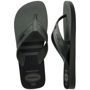 Pair of green, two tone Havaianas flip flops on a white background, with left shoe in focus