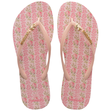 havaianas x LoveShackFancy pink flip flops with floral pattern and bow charm top view